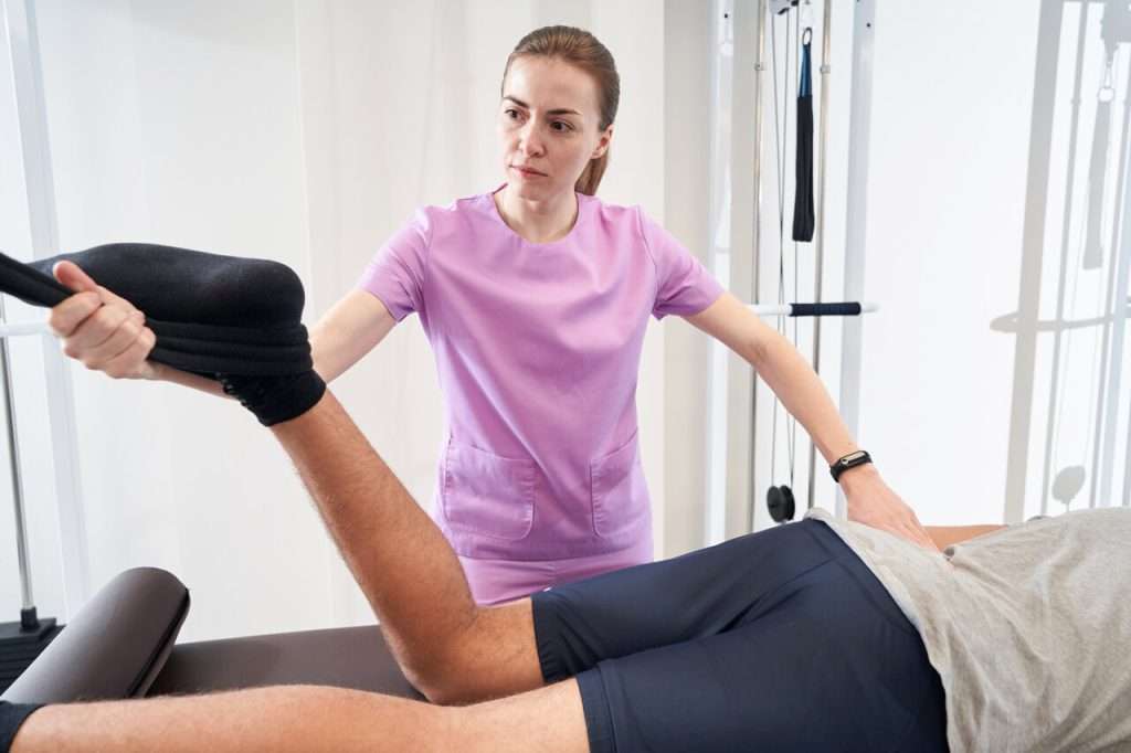 rsz man undergoing physical therapy procedure in rehab 2023 11 27 05 26 18 utc